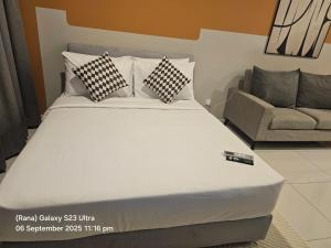 Кровать или кровати в номере Majestic Residence Kuala Lumpur +50 фотографий