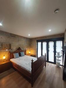 Ένα ή περισσότερα κρεβάτια σε δωμάτιο στο Casa Mucha - Rés do Chão e Andar