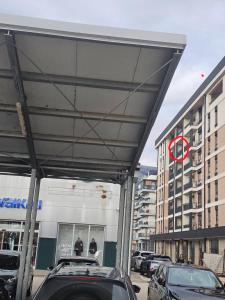 a car dealership with cars parked in a parking lot at Apartman Perfect in Trebinje +2 photos