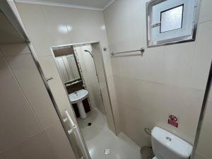 a bathroom with a shower and a toilet and a sink at Къща за гости Деметра in Velingrad +34 photos