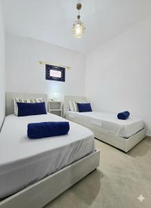 Postel nebo postele na pokoji v ubytování Traditional apartment the center of Agadir