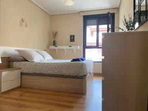 En eller flere senge i et værelse på Refugio entre montañas