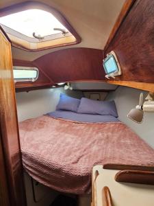 a small room with a bed in the middle at Lady Carmen in Key West