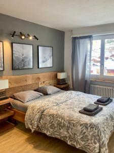 Postel nebo postele na pokoji v ubytování Best views and location in Leukerbad!