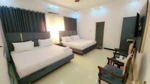 Postel nebo postele na pokoji v ubytování Comfort Lodge