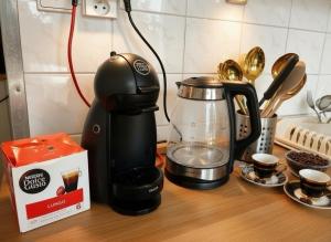 a coffee maker sitting on a counter next to a coffee pot at Cozy Apartment by the Forest in Tatranska Strba +6 photos