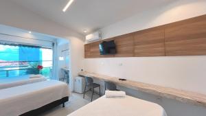 Μια τηλεόραση ή/και κέντρο ψυχαγωγίας στο Pousada Beach Claudia