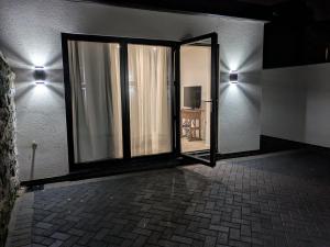 an open door to a room with a mirror at 2 bedroom house with yard in Cardiff