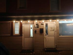 a house with lights on the side of it at night at Apartament Juliusz Slowacki in Szczawno-Zdrój