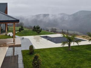 a backyard with a swimming pool and a house at HelenaHouse22 in Ledinci +17 photos