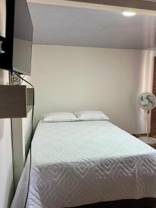 Una cama o camas en una habitación de donde la abuela Josefa