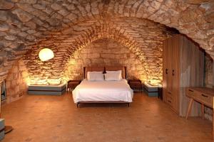 Una cama o camas en una habitación de casa nazareth