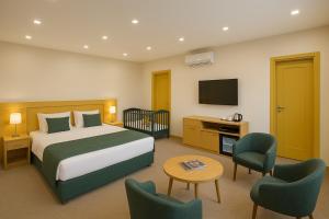 Ένα ή περισσότερα κρεβάτια σε δωμάτιο στο Khatai Rest Hotel +75 φωτογραφίες