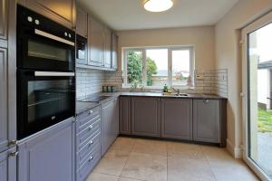 a kitchen with stainless steel appliances and a window at 2 minute walk to LUAS (tram) in Dublin