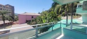 a view from the balcony of a house with a swimming pool at Edifício Vitória 1 Apt 203 in Marcelino Ramos