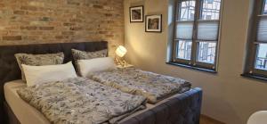 En eller flere senge i et værelse på Apartments in der Barockscheune