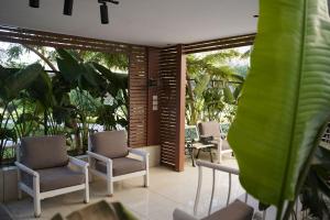 a group of chairs sitting on a patio at Garden Home in Sheikh Zayed