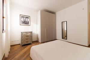 Postel nebo postele na pokoji v ubytování Appartamento 2 Leoni