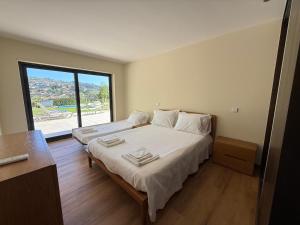 Una cama o camas en una habitación de Quinta de Sub-Ribas, ideal para famílias 31 fotos más