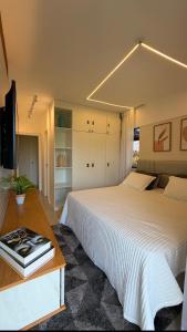 En eller flere senge i et værelse på Beach Place Resort