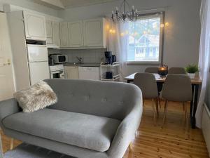 a living room with a couch and a table at Villa Adalia in Kalajoki