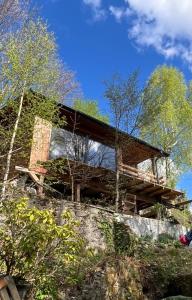a house on top of a hill with trees at Domek nad jeziorem w górach in Międzybrodzie Bialskie +26 photos