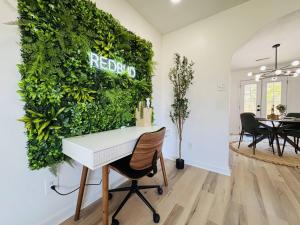 a white piano in a room with a green wall at Redbud Waterfront (Augusta Canal), king bed in Augusta +30 photos