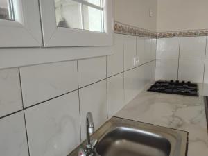 Η κουζίνα ή μικρή κουζίνα στο Chez JO