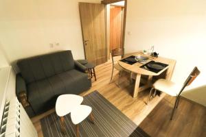 Posezení v ubytování Mother Teresa Apartments