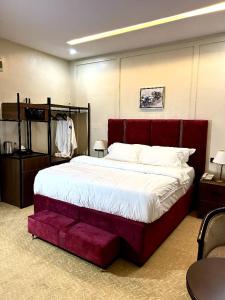 Postel nebo postele na pokoji v ubytování Eduardo Hotel Abuja