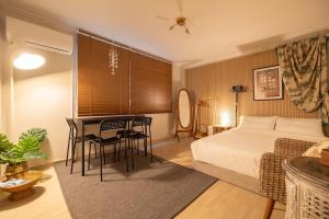 Ένα ή περισσότερα κρεβάτια σε δωμάτιο στο 테오스테이