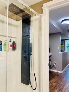 a bathroom with a glass shower in a room at Comfort Room-Free Parking & Cozy Stay in Charlottetown in Charlottetown