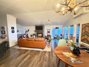 a living room with a couch and a table at Paws at the Peak in Beech Mountain