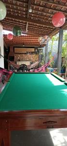 a pool table in the middle of a room at Garden JP in João Pessoa