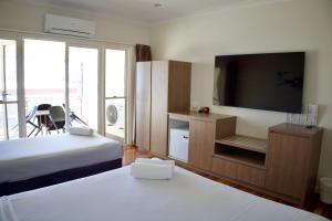 Postel nebo postele na pokoji v ubytování The Australian Hotel Motel + 35 fotografií