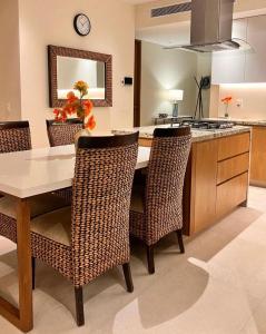 a kitchen with a table and chairs and a counter at Casa Cielo V-Bucerias in Bucerías +14 photos