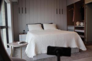 Ένα ή περισσότερα κρεβάτια σε δωμάτιο στο Aconchego Amazônico no Tropical Executive