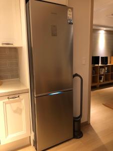 a stainless steel refrigerator in a kitchen at 여성전용1인숙소 Milli Home 