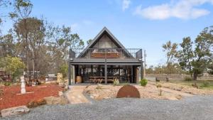 a house in the middle of a park at Vineyard Accommodation in Dorrien