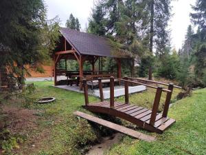 a picnic shelter with benches in a park at Chata MOBY in Važec