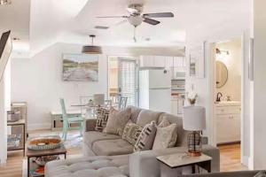 a living room with a couch and a table at Sandy Pines Perch - Your Indian River Dock Life Base Camp in Sebastian +28 photos