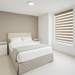 Postel nebo postele na pokoji v ubytování SextoMaíz