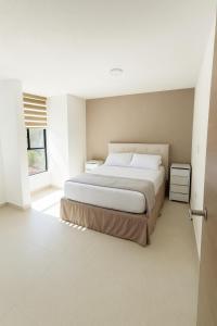 Postel nebo postele na pokoji v ubytování SextoMaíz