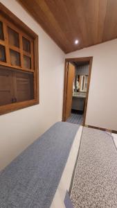 Postel nebo postele na pokoji v ubytování Chalé Gravatinha + 15 fotografií