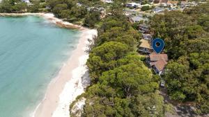 an aerial view of a beach with a house at Amazing Views - Belle Escapes Jervis Bay in Vincentia