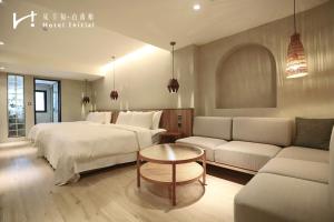 Giường trong phòng chung tại Hotel Initial-Tainan