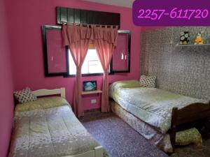 En eller flere senge i et værelse på La casita de ramon