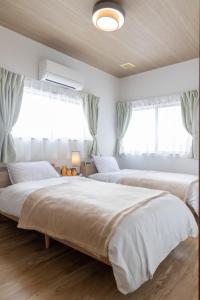 Ένα ή περισσότερα κρεβάτια σε δωμάτιο στο icoina