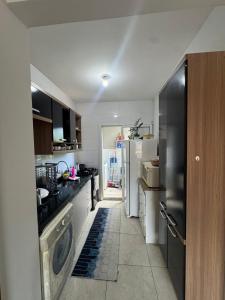 Фотография из галереи Apartamento em Matinhos aconchegante в городе Матиньюс