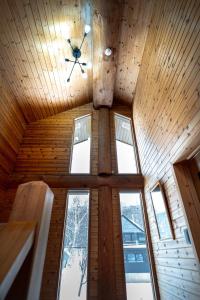 a room with a ceiling with windows and a ceiling fan at Terrace Niseko Glide in Kutchan